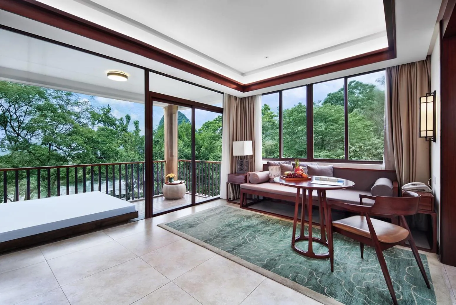 Seating area, Bed in Yangshuo Riverside Resorts Hotel