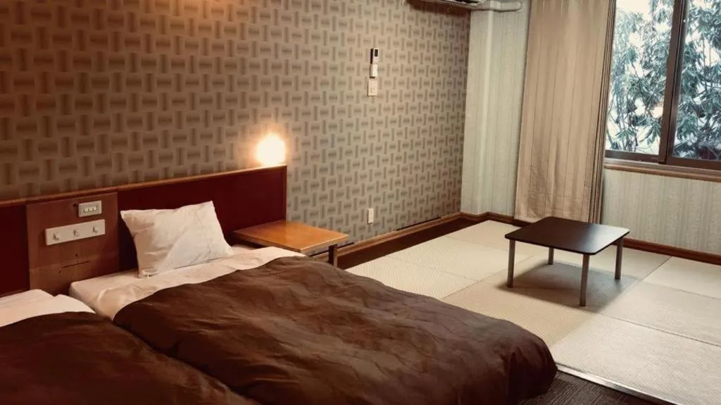 Bed in Ikenotaira Hotel