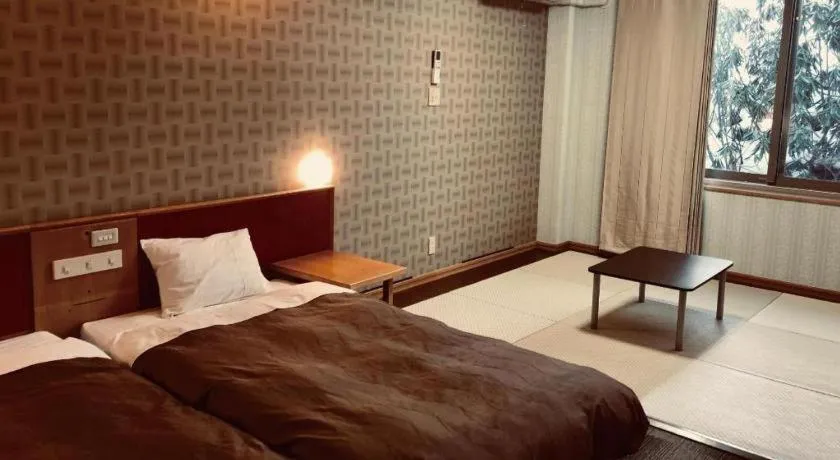 Bed in Ikenotaira Hotel