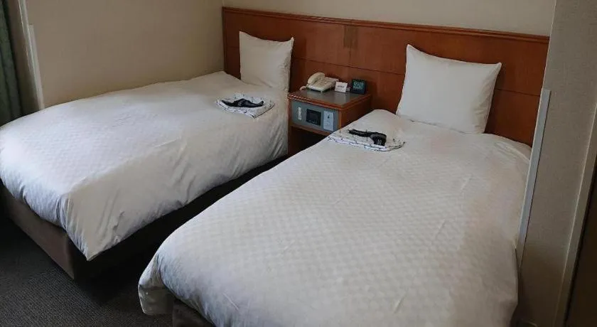 Bed in Pearl Hotel Ota