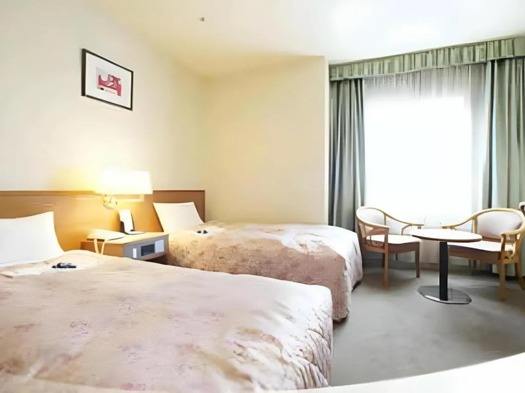 Bed in Pearl Hotel Ota