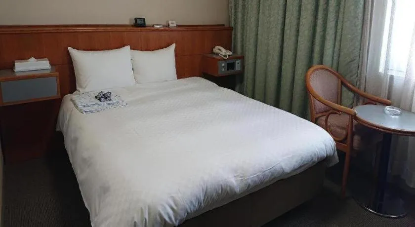 Bed in Pearl Hotel Ota