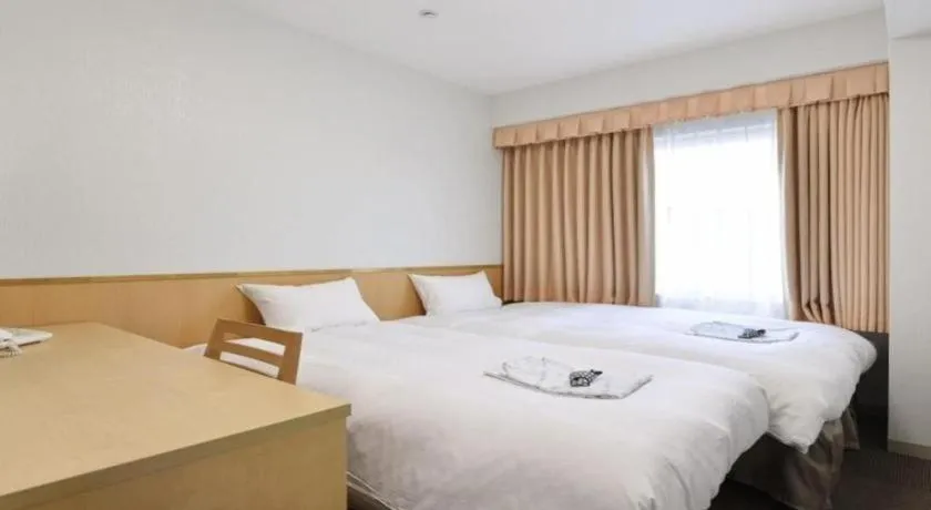 Bed in Pearl Hotel Ota