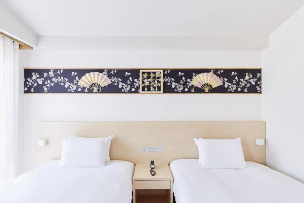 Bed in Hotel Sunroute Kyoto