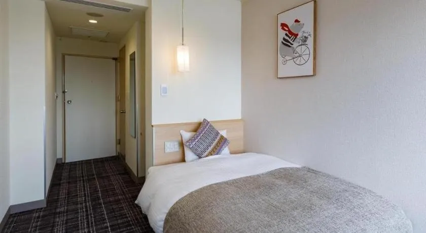 Bed in Miyazaki Kanko Hotel