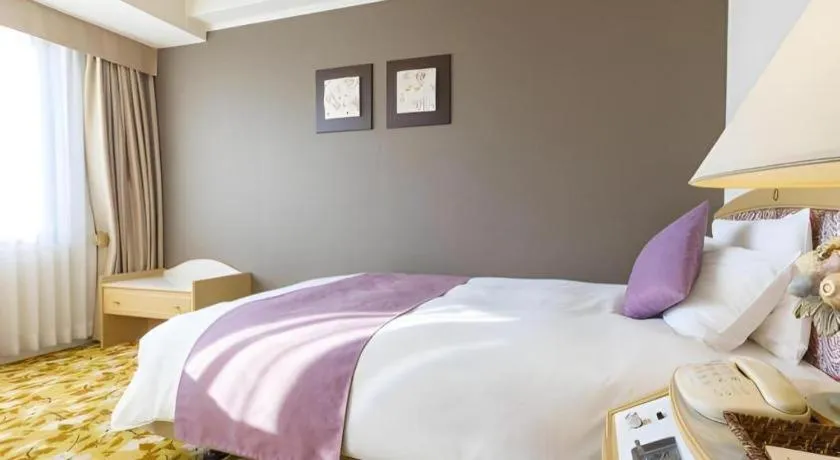 Bed in Miyazaki Kanko Hotel