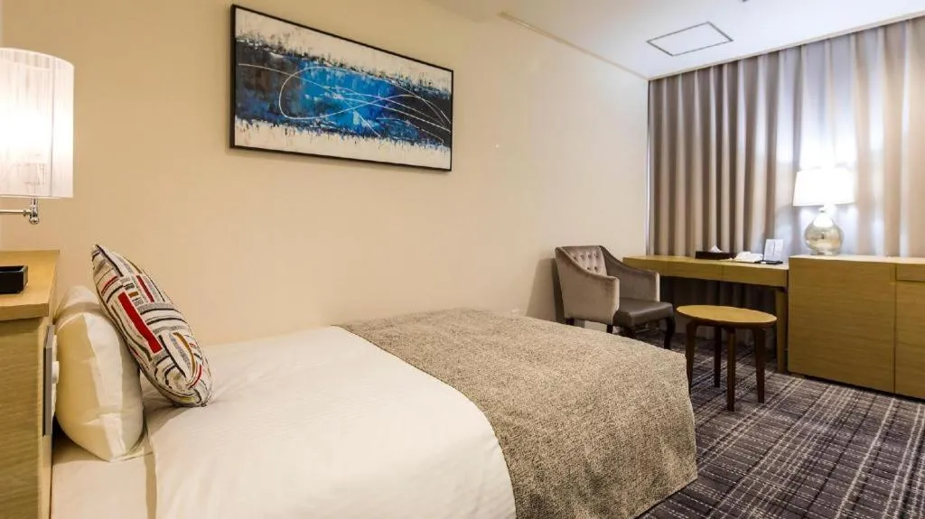 Bed in Miyazaki Kanko Hotel