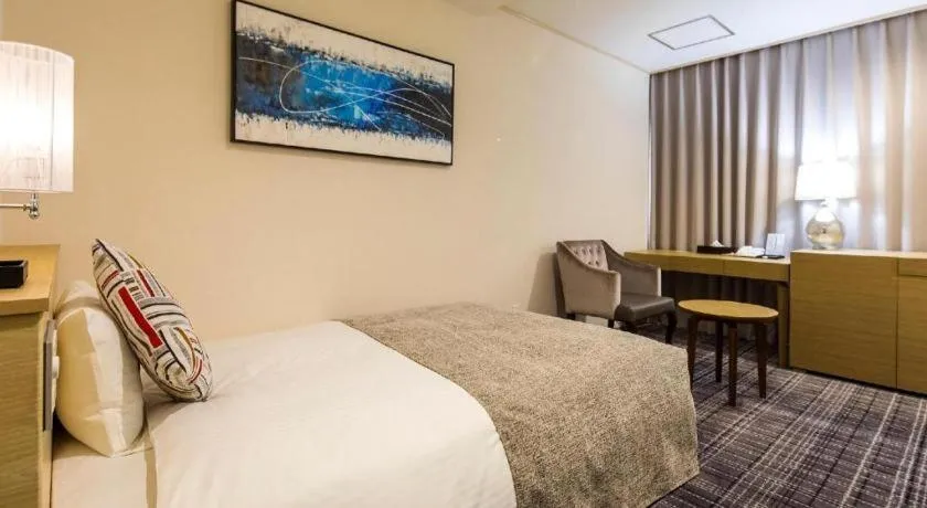 Bed in Miyazaki Kanko Hotel