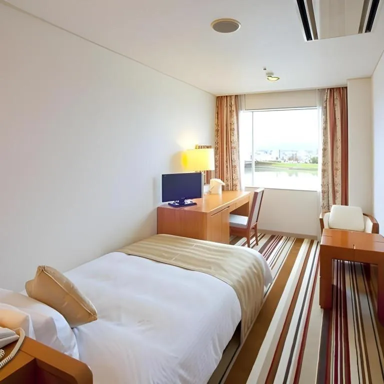 Bed in Miyazaki Kanko Hotel