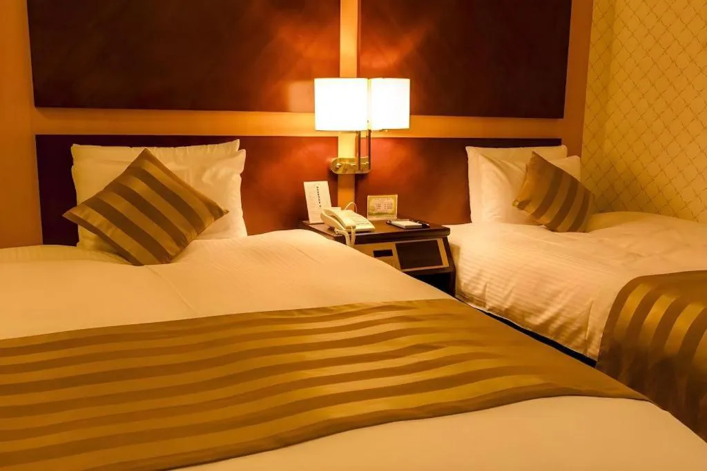 Bed in Miyazaki Kanko Hotel