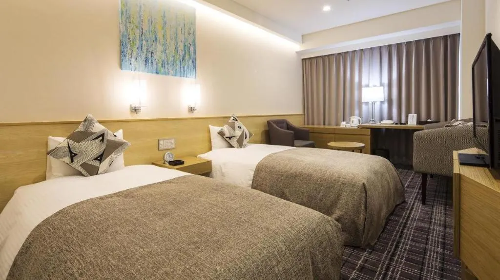 Bed in Miyazaki Kanko Hotel