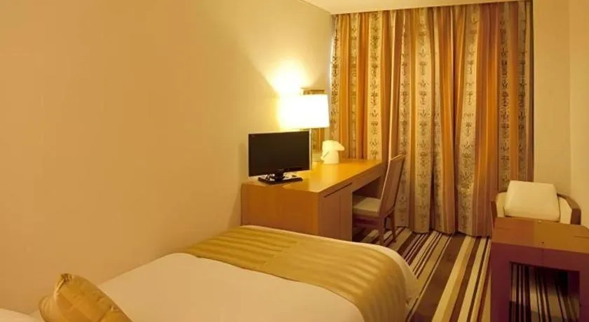 Bed in Miyazaki Kanko Hotel