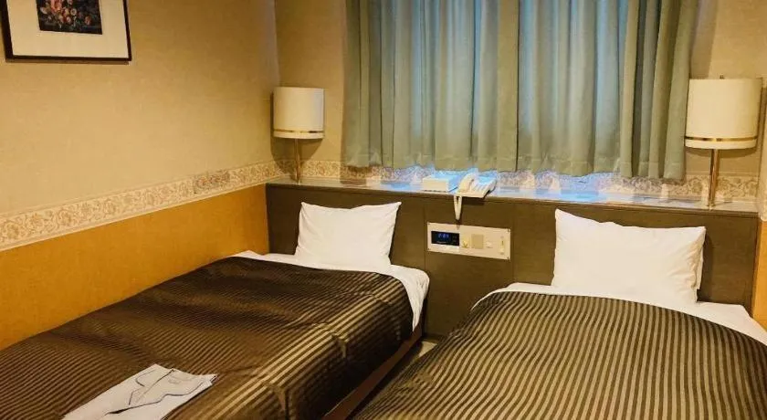 Bed in The Hamilton Sapporo Hotel