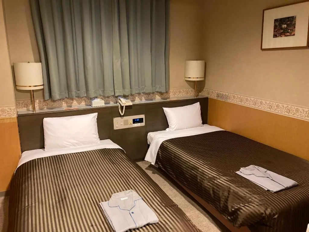 Bed in The Hamilton Sapporo Hotel