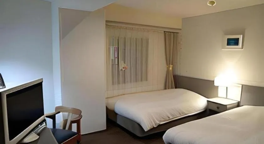 Bed in Hotel Ronshan Sapporo