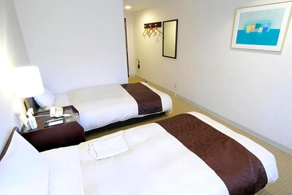 Bed in Hiroshima Kokusai Hotel