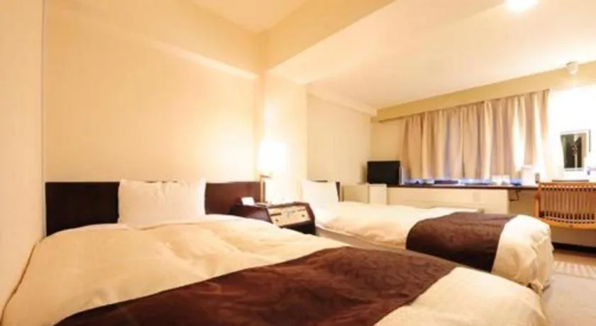 Bed in Hiroshima Kokusai Hotel