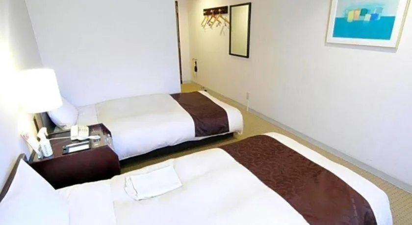 Bed in Hiroshima Kokusai Hotel