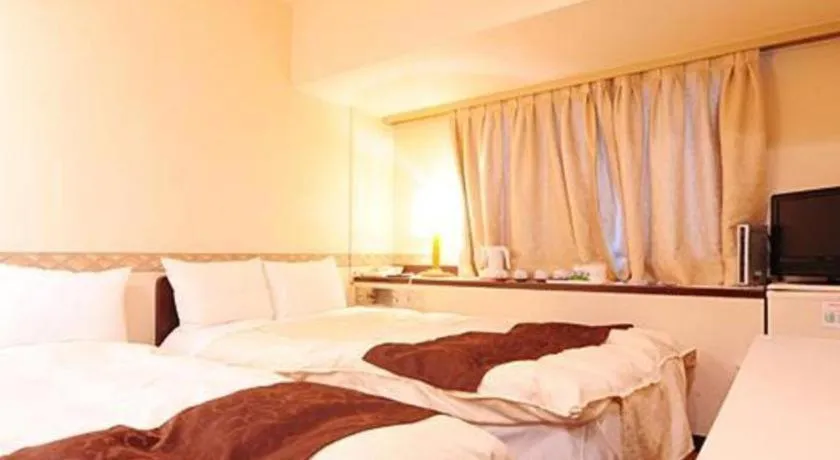 Bed in Hiroshima Kokusai Hotel