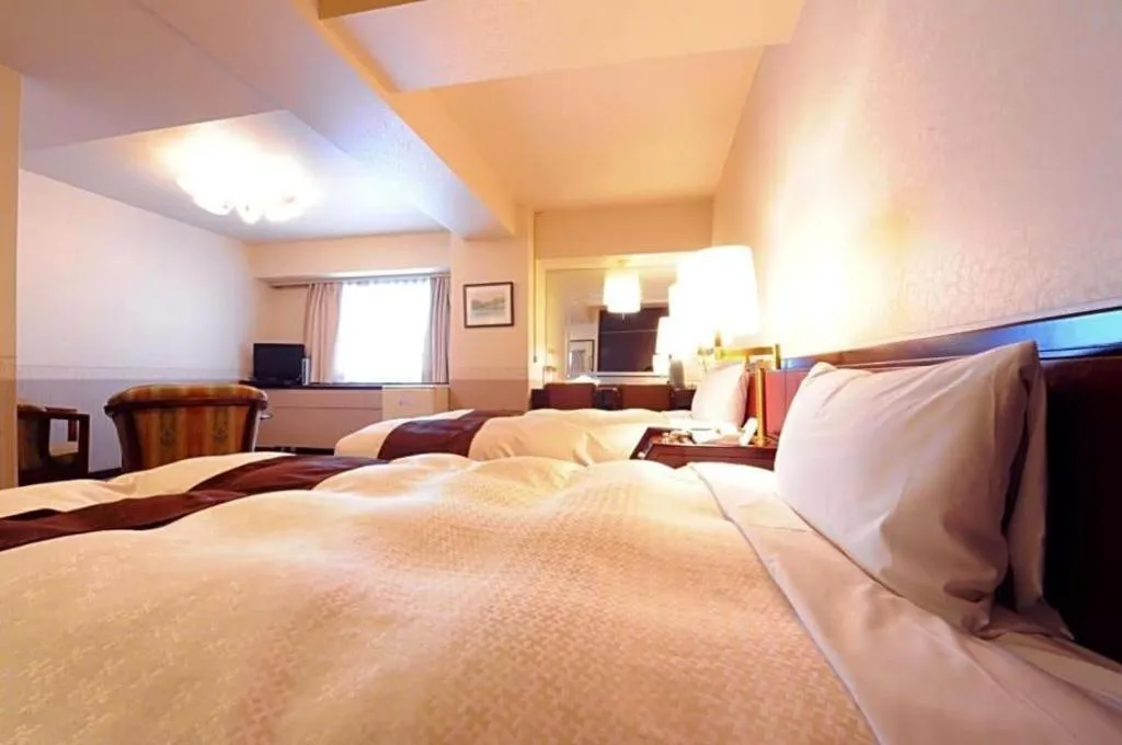 Bed in Hiroshima Kokusai Hotel