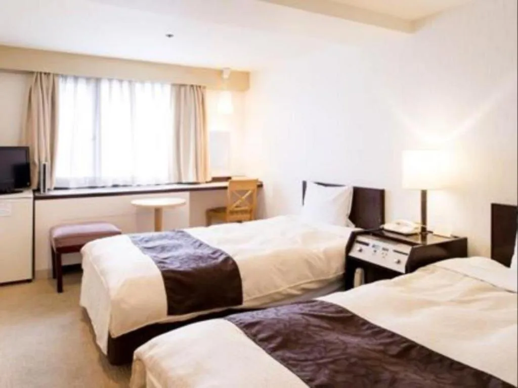 Bed in Hiroshima Kokusai Hotel