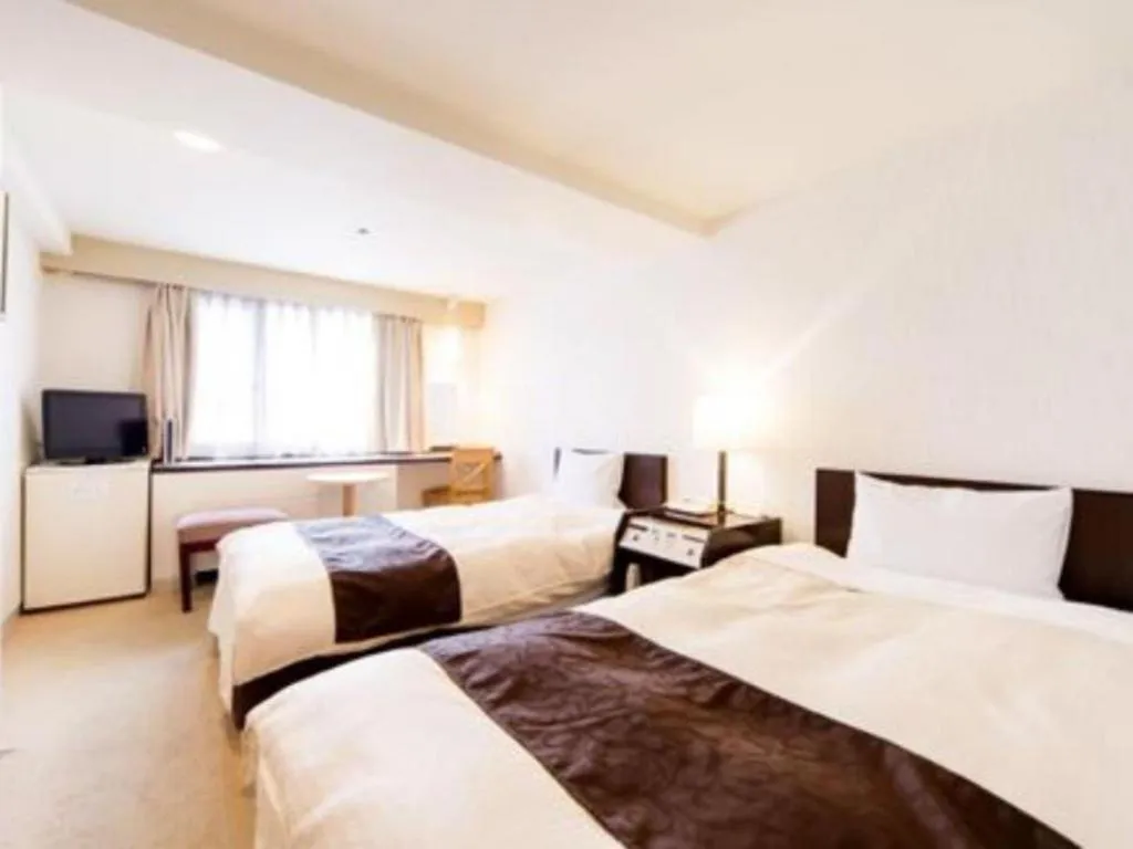 Bed in Hiroshima Kokusai Hotel