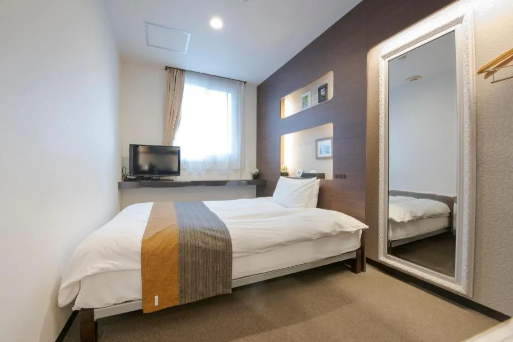 Bed in Hotel New Palace Aizuwakamatsu