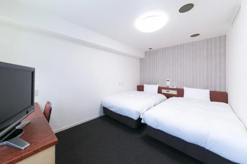 Bed in Pearl Hotel Kawasaki