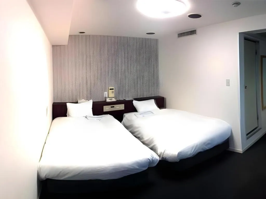 Bed in Pearl Hotel Kawasaki