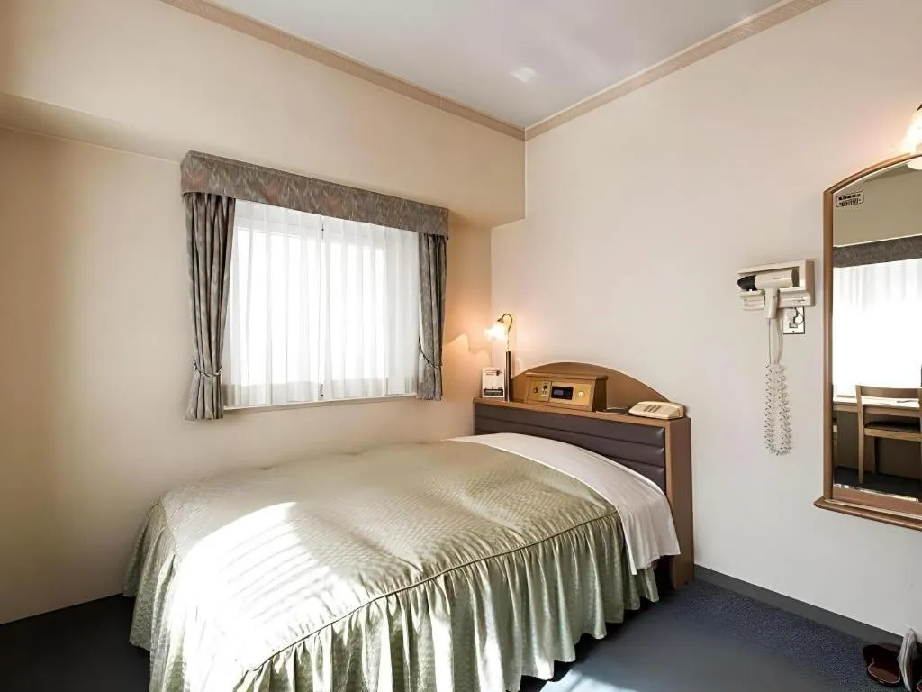 Bed in Hotel Starplaza Ikebukuro