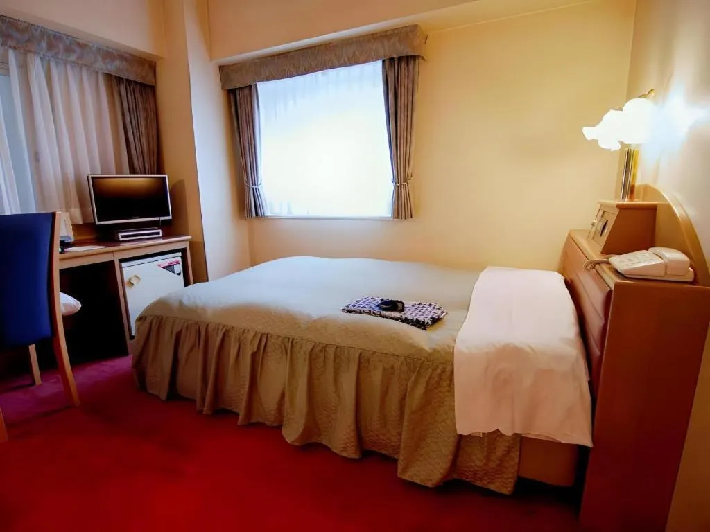 Bed in Hotel Starplaza Ikebukuro