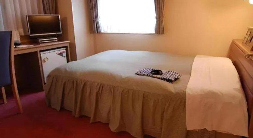 Bed in Hotel Starplaza Ikebukuro