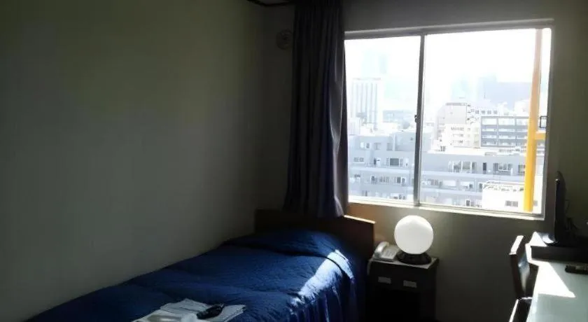 Bed in Tokyo Business Hotel