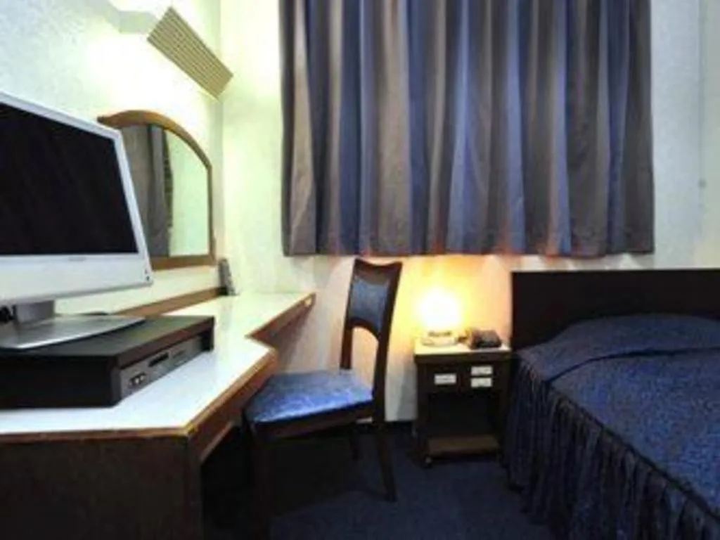 Bed in Tokyo Business Hotel