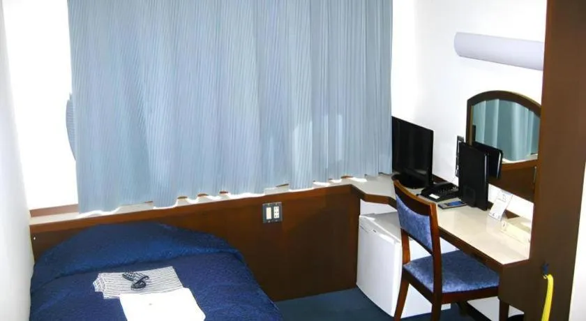 Bed in Tokyo Business Hotel