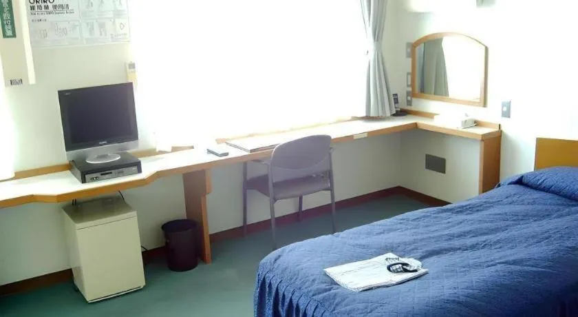 Bed in Tokyo Business Hotel