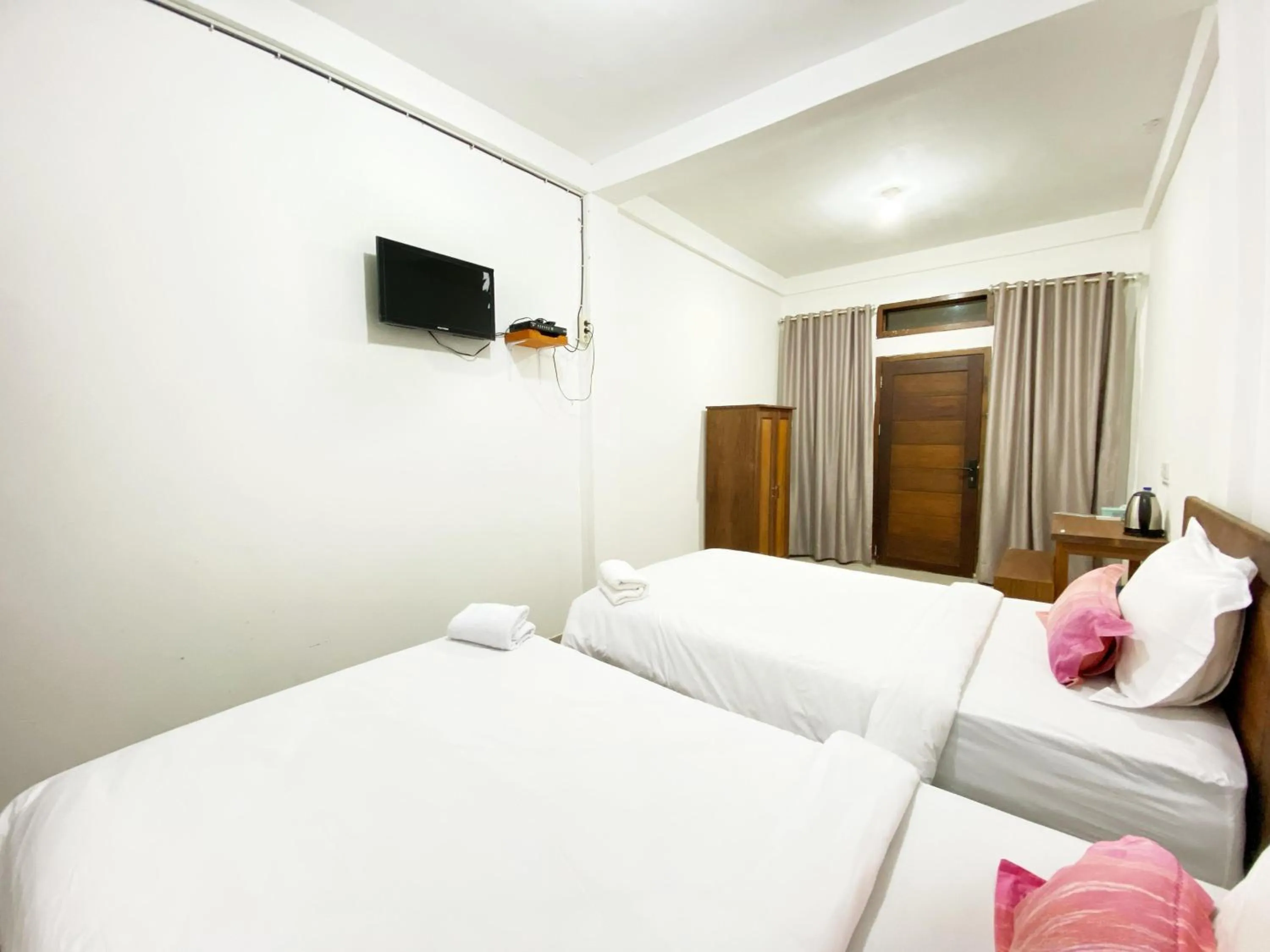 Bed in Bujai Mentawai Griya Hotel