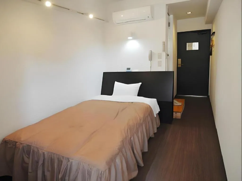 Bed in Hotel Tetora Tsurumi