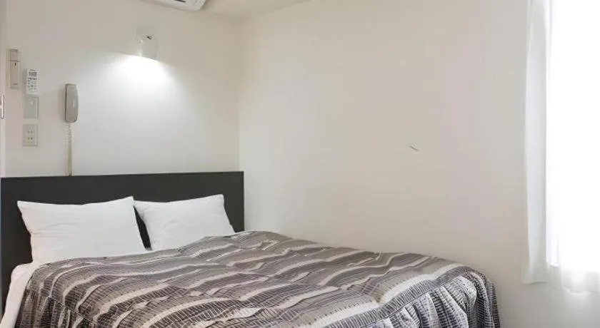 Bed in Hotel Tetora Tsurumi