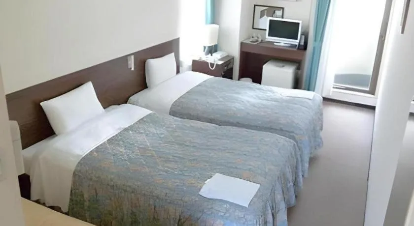 Bed in Hotel Tetora Tsurumi