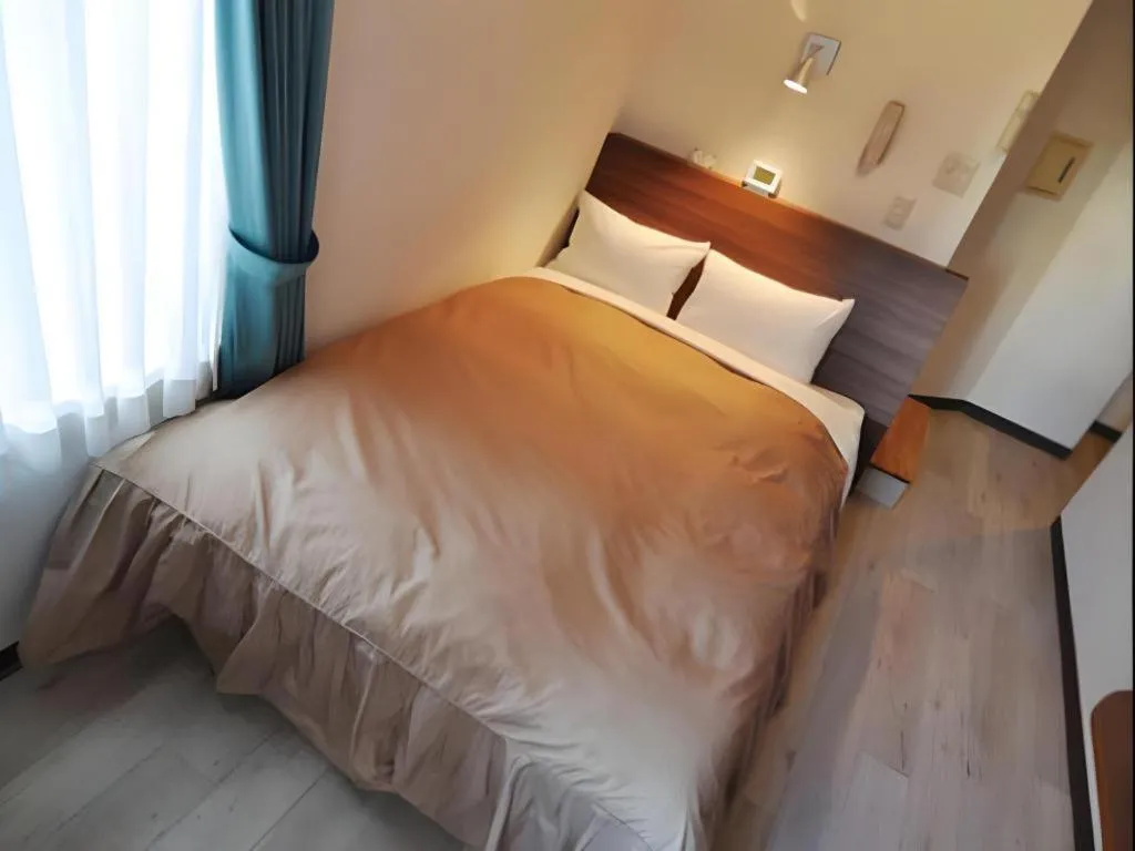 Bed in Hotel Tetora Tsurumi