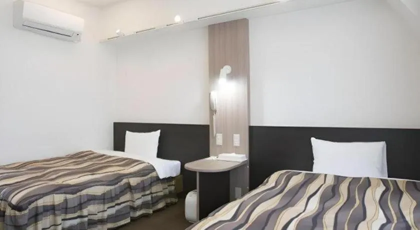 Bed in Hotel Tetora Tsurumi