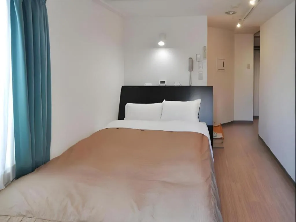 Bed in Hotel Tetora Tsurumi