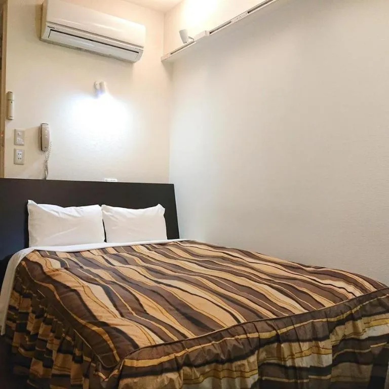 Bed in Hotel Tetora Tsurumi