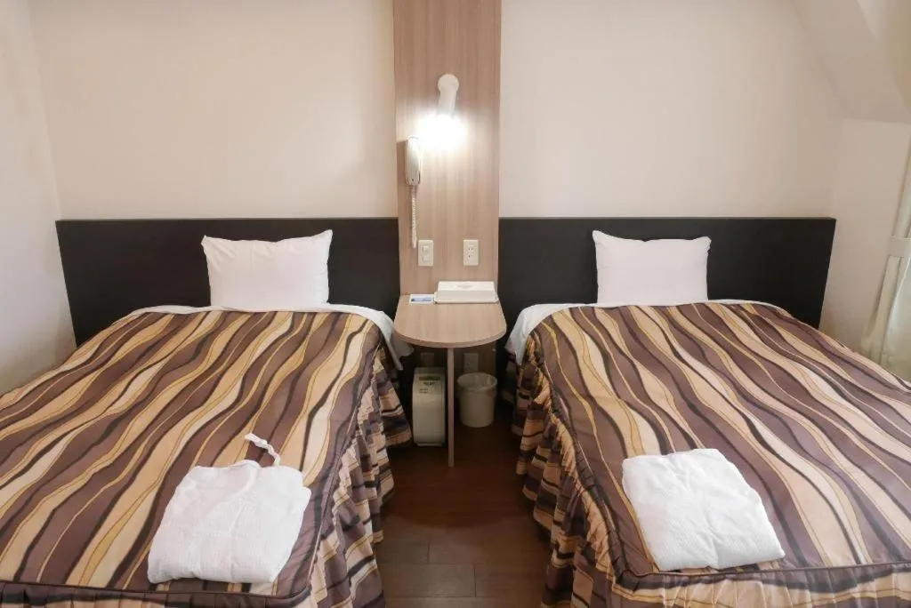 Bed in Hotel Tetora Tsurumi