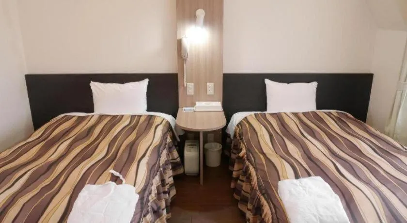 Bed in Hotel Tetora Tsurumi