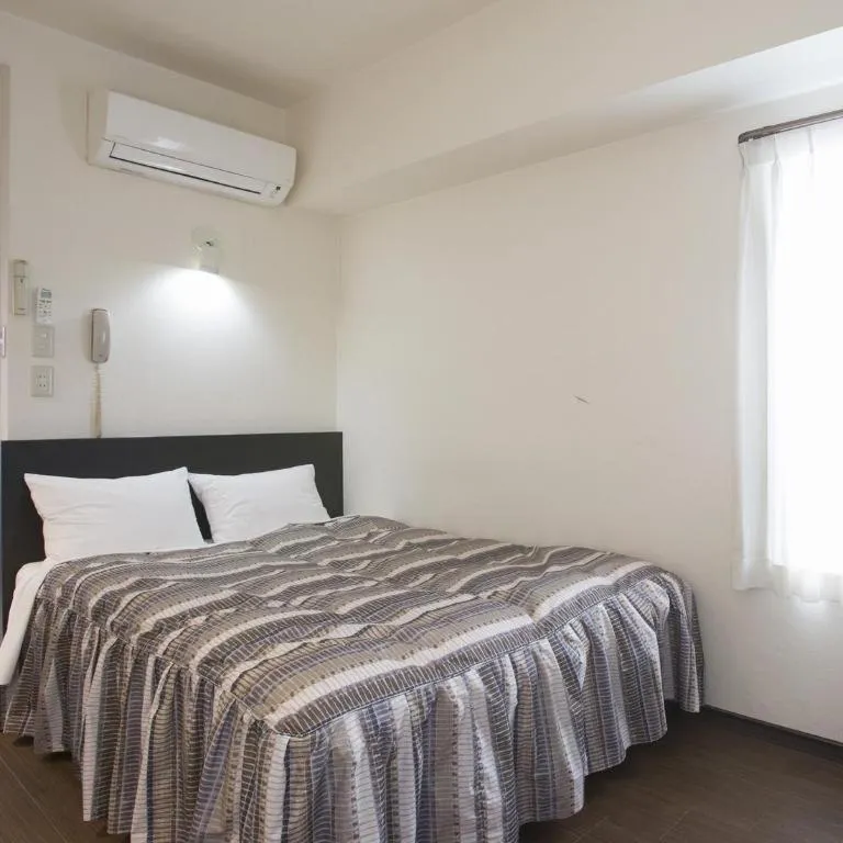 Bed in Hotel Tetora Tsurumi