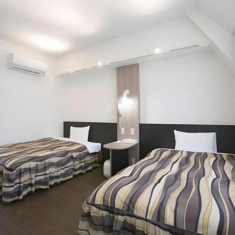 Bed in Hotel Tetora Tsurumi