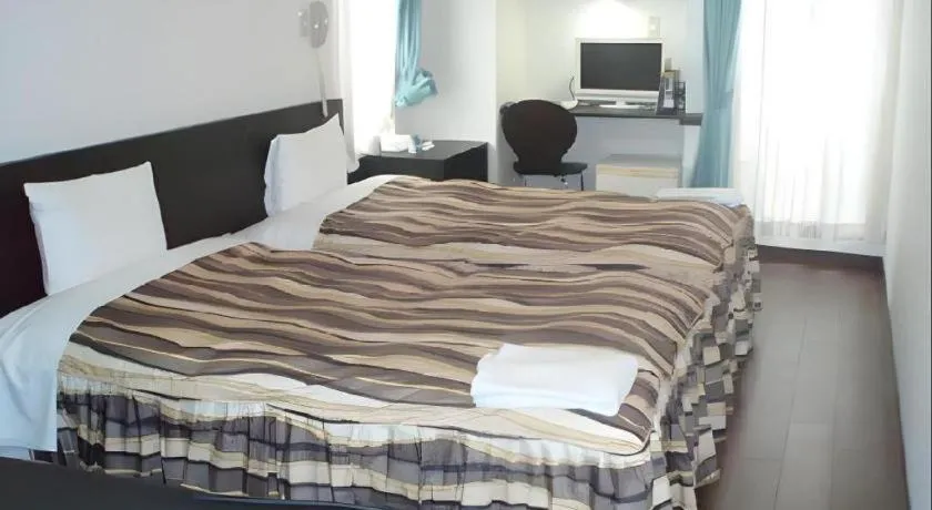 Bed in Hotel Tetora Tsurumi