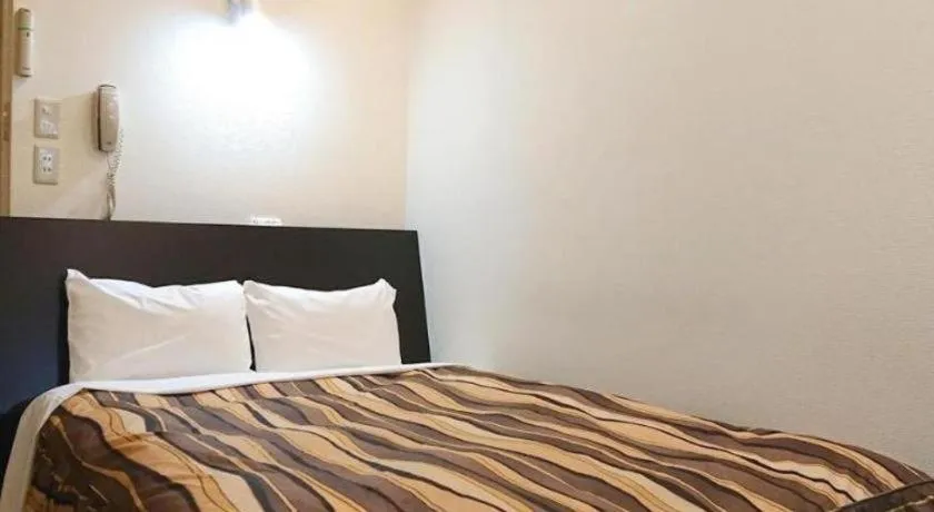 Bed in Hotel Tetora Tsurumi